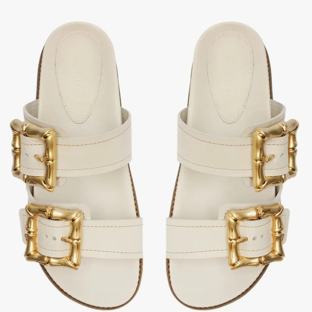SCHUTZ Cream and Gold Slide Sandals with Buckle Accents